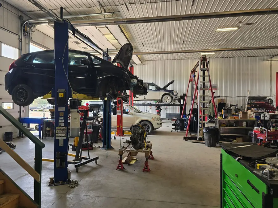 Vehicles on lifts in the service bays